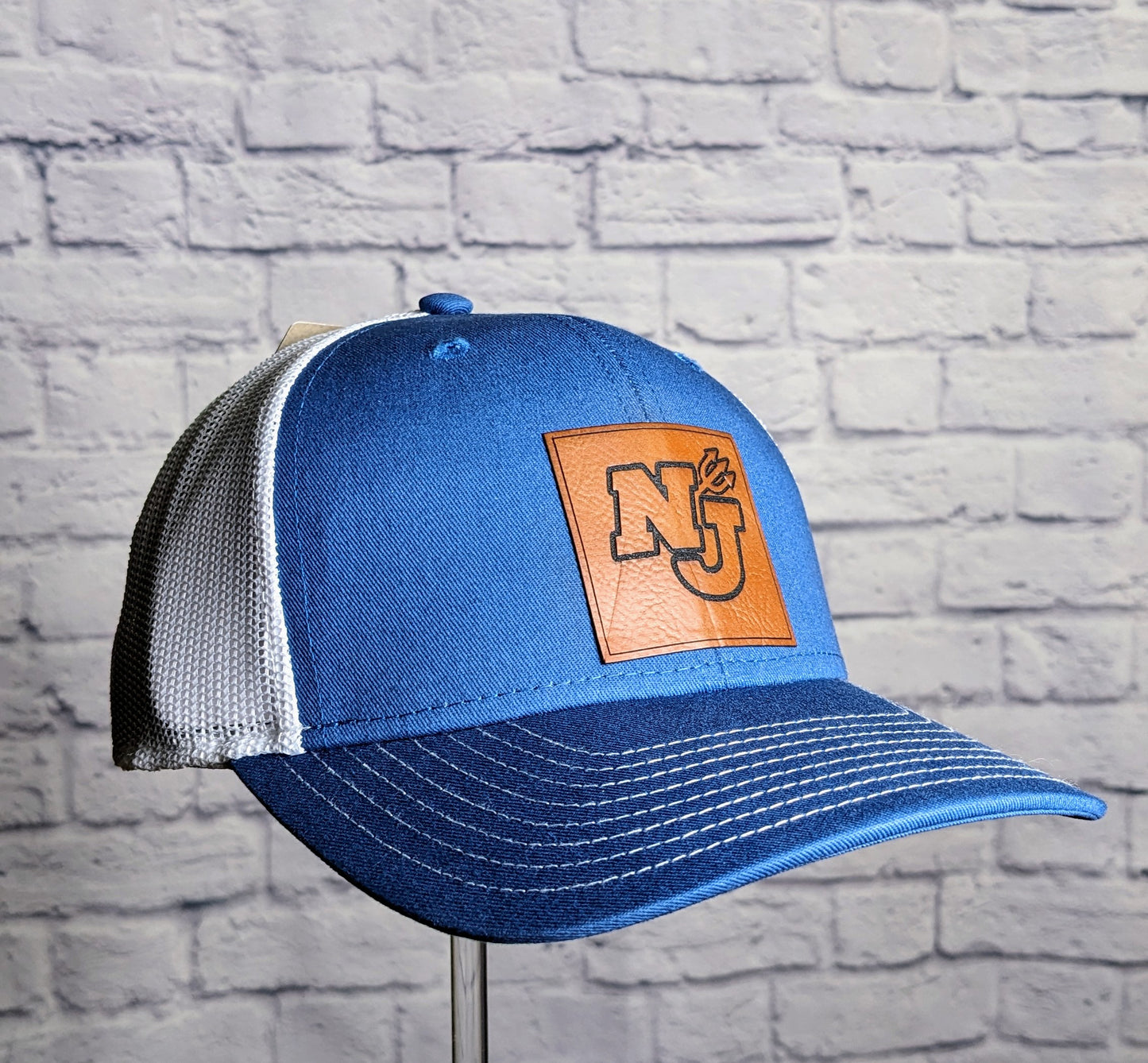 North Jefferson Leather Patch on The Game Trucker Hat