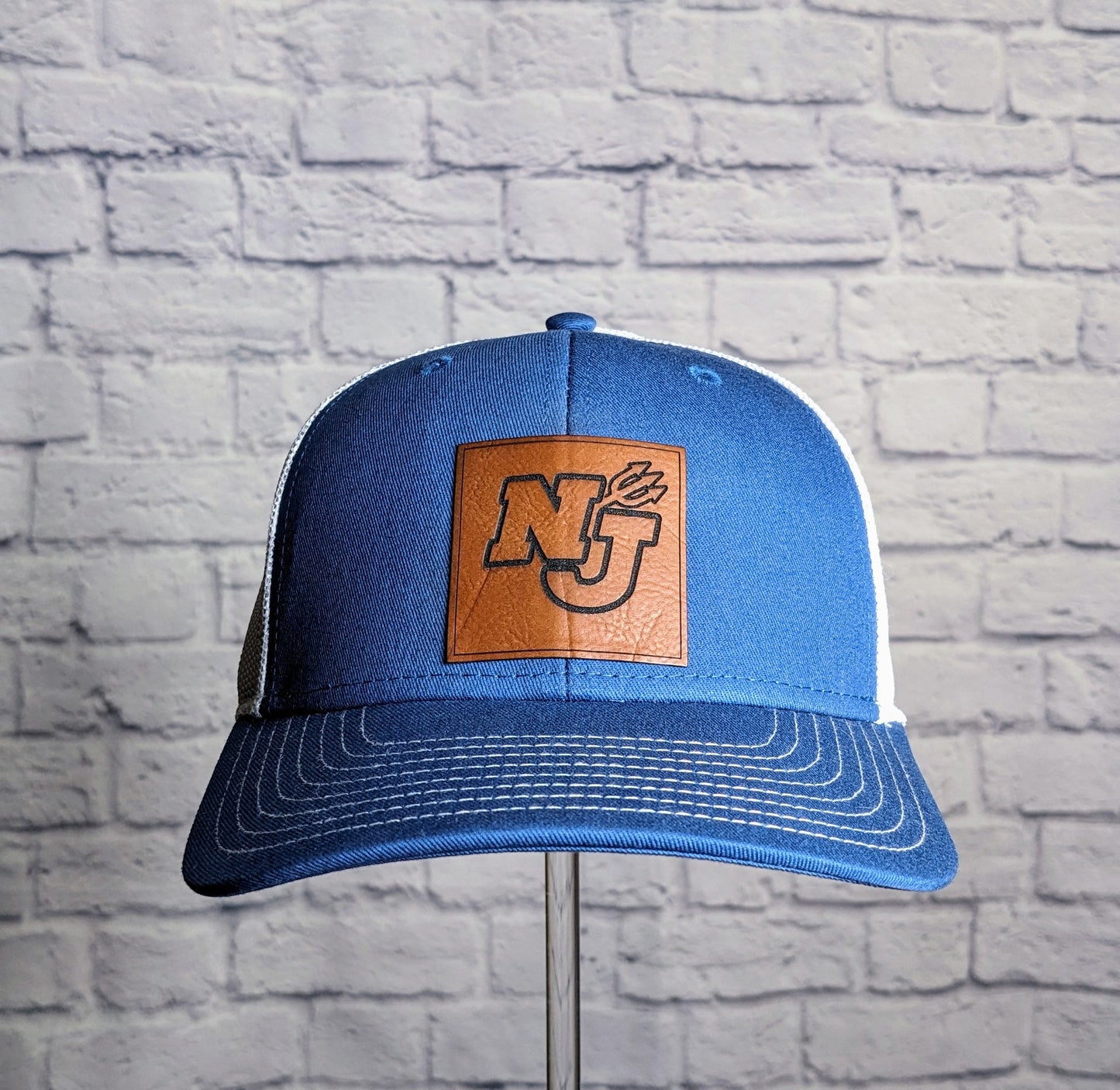 North Jefferson Leather Patch on The Game Trucker Hat